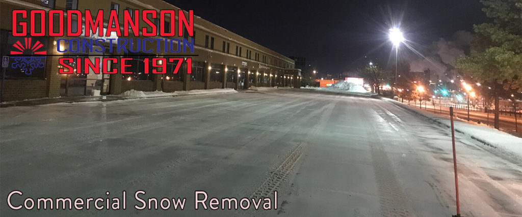 Commercial Snow Removal a clear parking lot freshly plowed at two in the morning