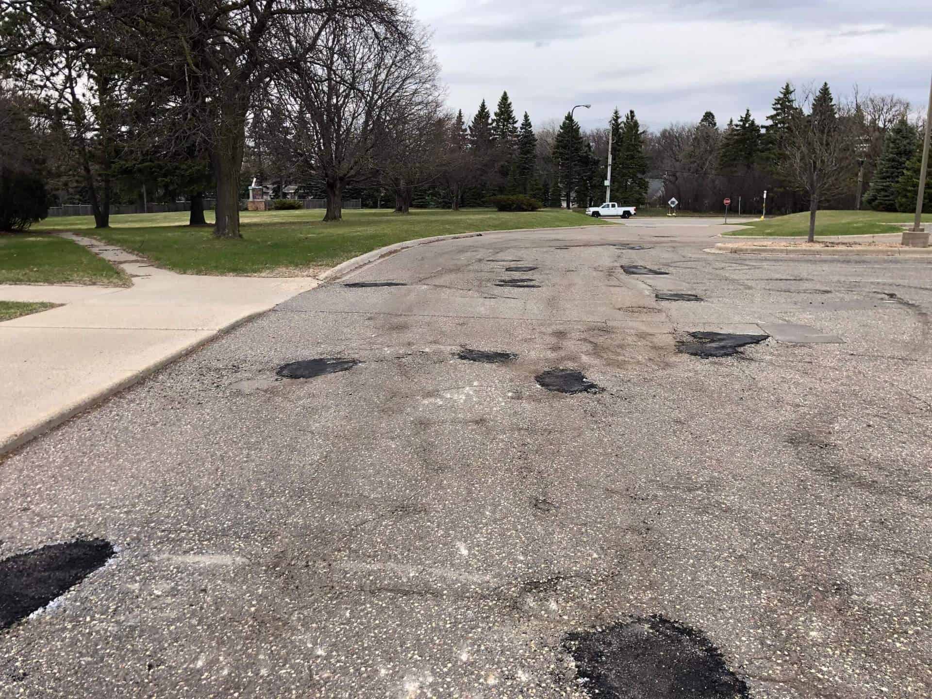 A picture of an asphalt parking lot with Skin Patching Pothole Repair