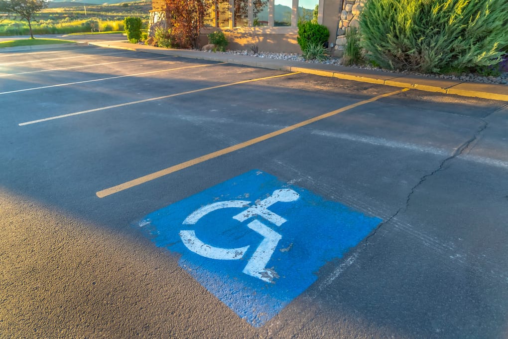 handicap space in asphalt roading material parking lot